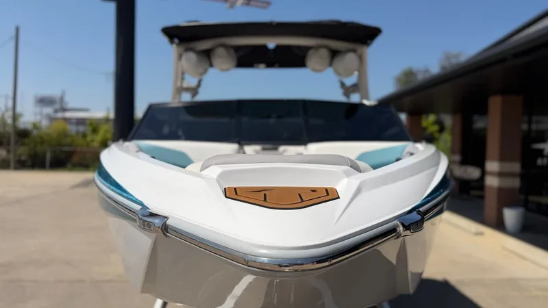 Slide: The Image of A 2021 Tigé Z3 boat with a sleek design, sitting on a trailer. - 8