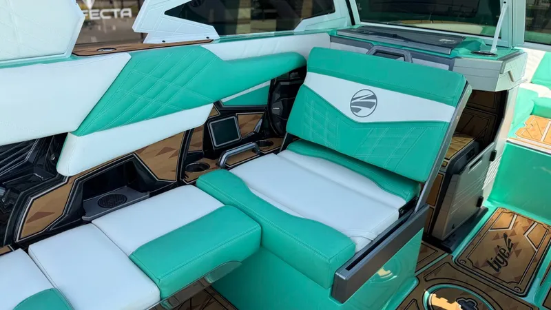 Slide: The Image of The interior of a 2025 Tigé Ultré 23ZX with turquoise and white seating and modern details. - 20
