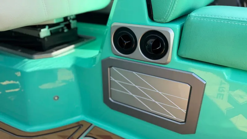 Slide: The Image of Close-up of a turquoise boat interior with air vents and modern design. - 24