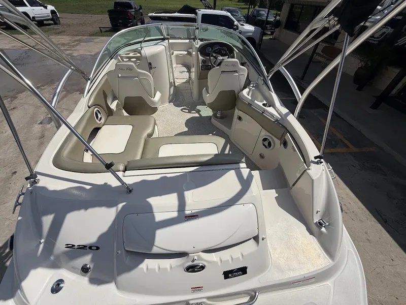 Slide: The Image of A 2007 Sea Ray 220 Sundeck with spacious cockpit and comfortable seating, ideal for leisure cruising. - 11
