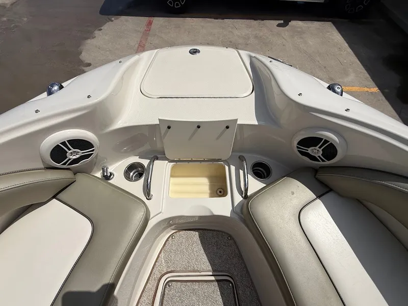 Slide: The Image of The image shows the bow of a 2007 Sea Ray 220 Sundeck boat with speakers and seating. - 24