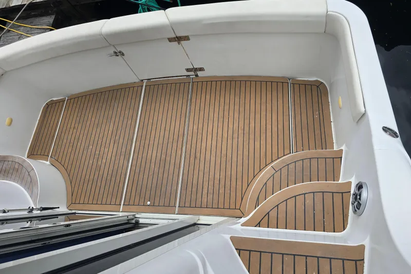 Slide: The Image of 1998 Carver 350 Mariner boat deck with teak flooring and white seating. - 15