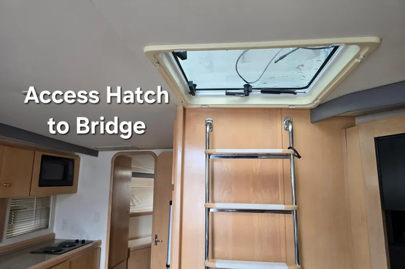 Slide: The Image of Access hatch to bridge inside 1998 Carver 350 Mariner yacht interior. - 25