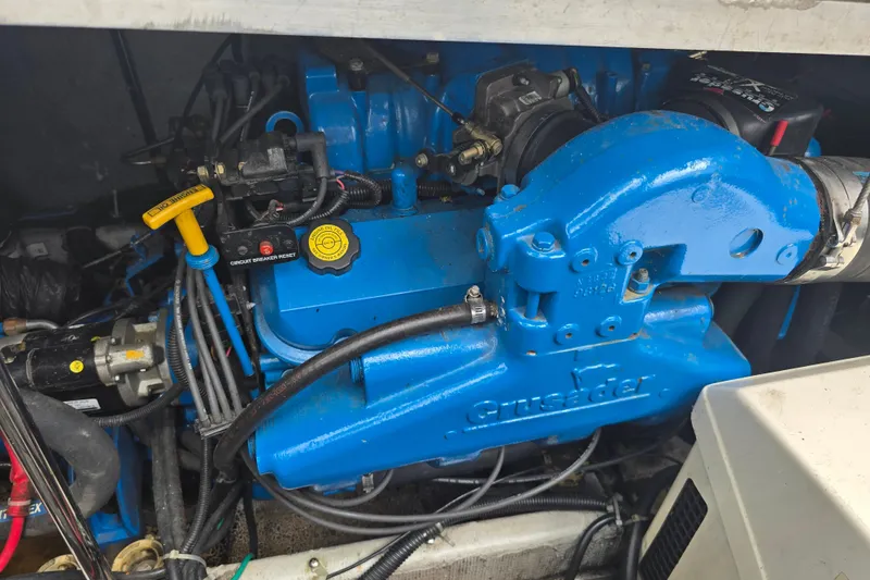 Slide: The Image of Engine compartment of a 1998 Carver 350 Mariner with blue Crusader engine. - 19