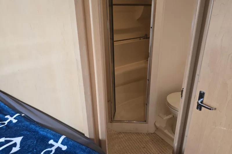 Slide: The Image of Interior of 1998 Carver 350 Mariner showing bathroom and partial bedroom view. - 35