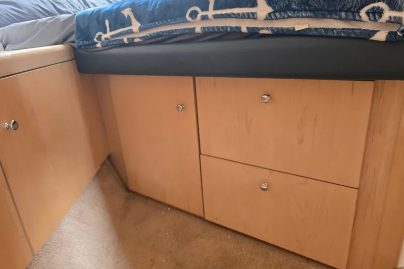 Slide: The Image of Wooden cabinetry and bed in 1998 Carver 350 Mariner interior. - 34