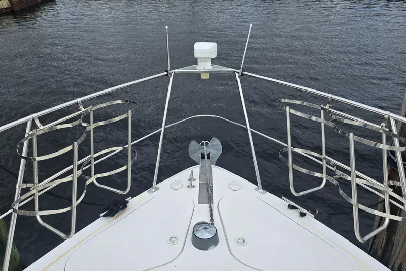 Slide: The Image of Bow view of 1998 Carver 350 Mariner yacht with stainless steel railings. - 6