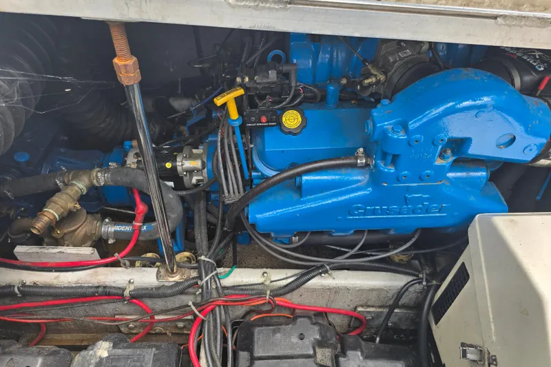 Slide: The Image of Engine compartment of a 1998 Carver 350 Mariner with Crusader engine components. - 17