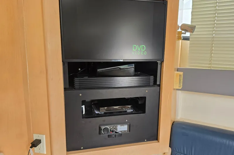 Slide: The Image of Entertainment system with DVD player inside a 1998 Carver 350 Mariner yacht. - 24