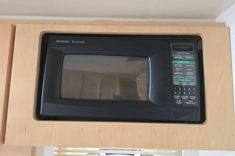 Slide: The Image of Built-in Sharp Carousel microwave in a 1998 Carver 350 Mariner yacht kitchen. - 29