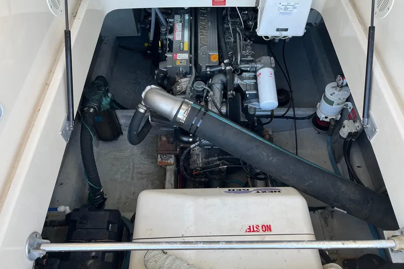 Slide: The Image of Engine compartment of a 2007 Mainship Pilot 34 Sedan boat, showcasing mechanical components. - 5