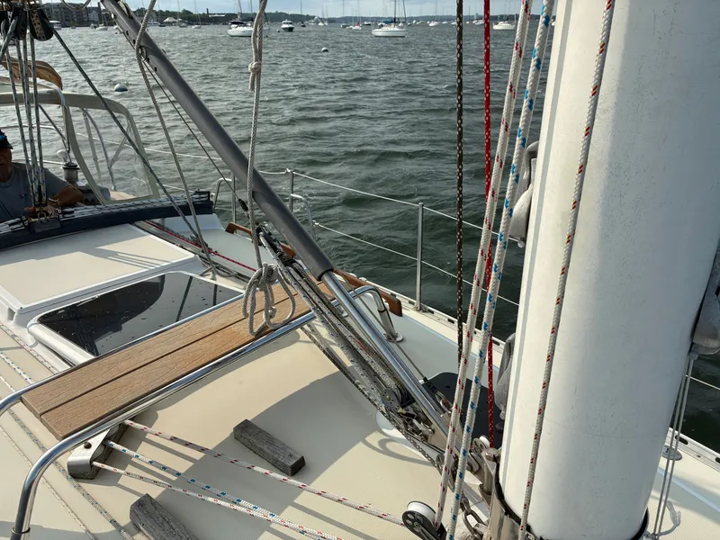 Slide: The Image of The image shows the deck of a 1986 Freedom Yachts 30 with sailing equipment. - 18