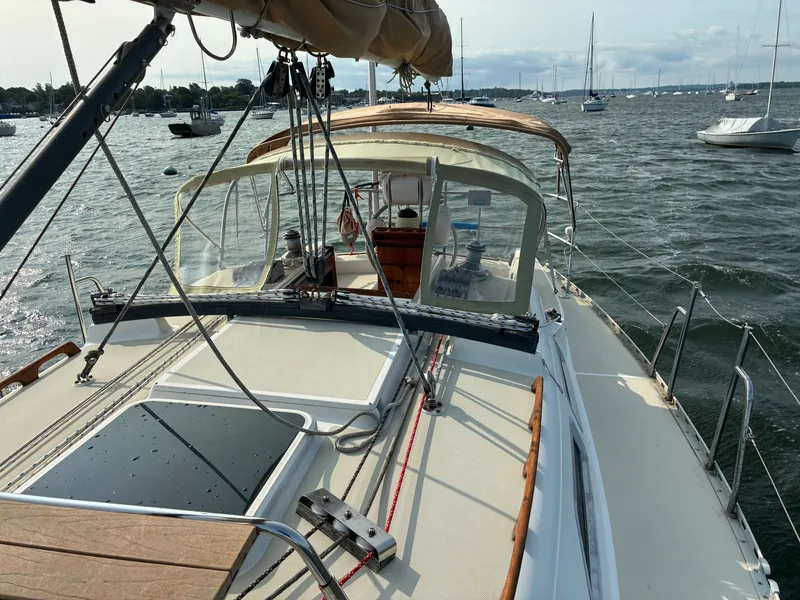 Slide: The Image of A 1986 Freedom Yachts 30 sailing on calm waters with other boats in the background. - 17