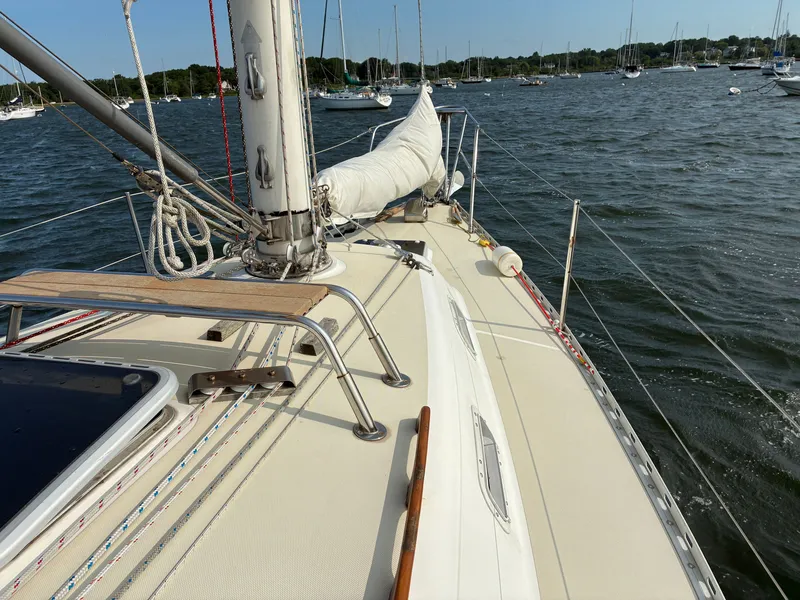 Slide: The Image of The deck of a 1986 Freedom Yachts 30 on calm waters with other boats in the background. - 11