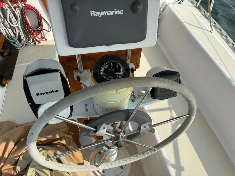 Slide: The Image of The image shows the helm of a 1986 Freedom Yachts 30 with Raymarine equipment. - 8