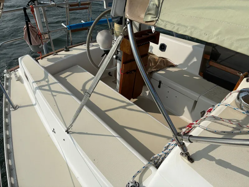 Slide: The Image of The cockpit of a 1986 Freedom Yachts 30 with a steering wheel and seating benches. - 5