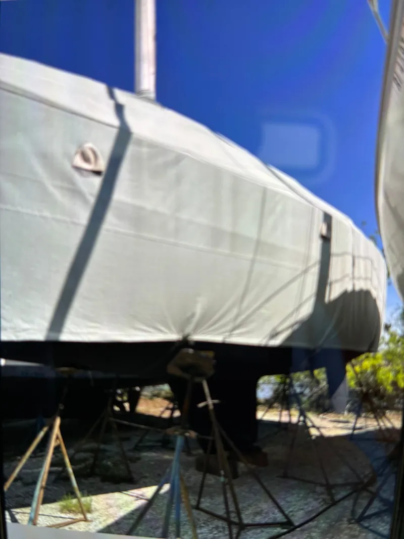 Slide: The Image of A 1986 Freedom Yachts 30 is on stands, covered with a protective tarp. - 41
