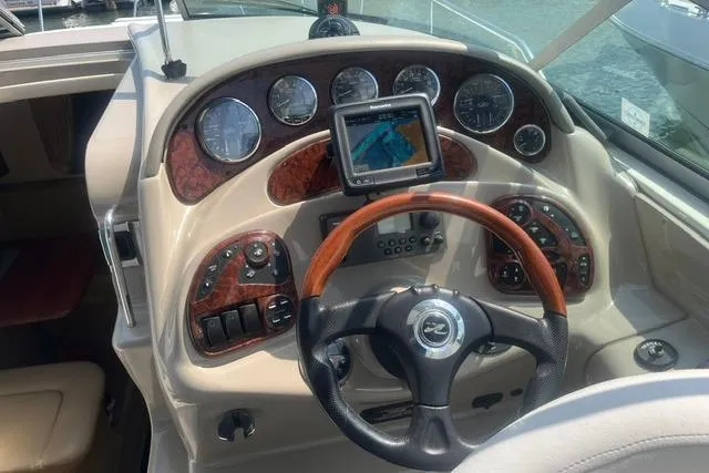 Slide: The Image of Helm of 2006 Sea Ray Sundancer 280 with wood accents and navigation system. - 12