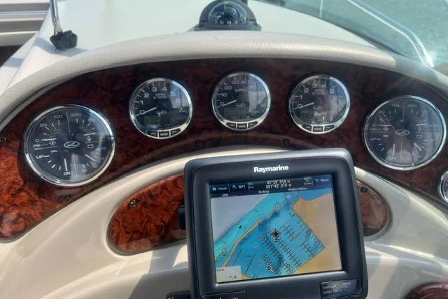Slide: The Image of Dashboard of a 2006 Sea Ray Sundancer 280 with navigation system and gauges. - 13