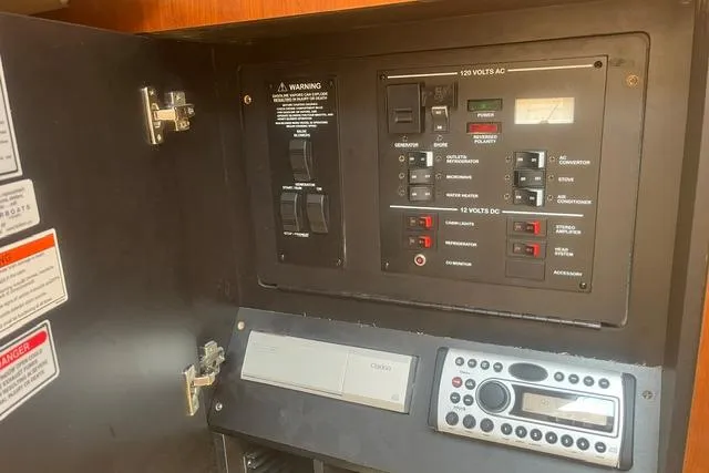 Slide: The Image of Electrical control panel inside 2006 Sea Ray Sundancer 280 boat cabin. - 18