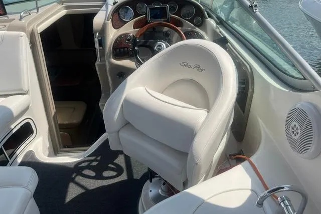 Slide: The Image of 2006 Sea Ray Sundancer 280 cockpit with plush seating and modern dashboard controls. - 7