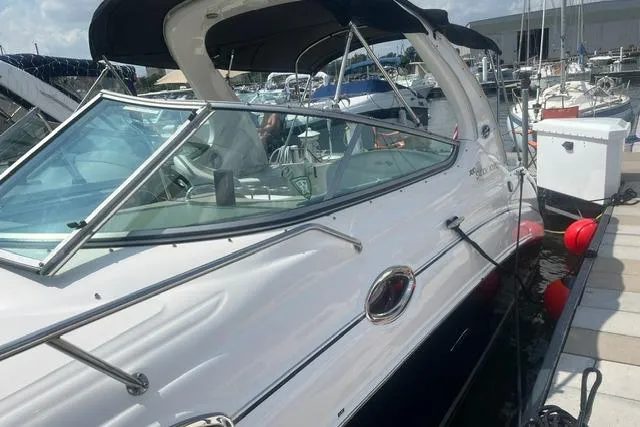 Slide: The Image of 2006 Sea Ray Sundancer 280 docked at marina, featuring sleek design and modern amenities. - 4