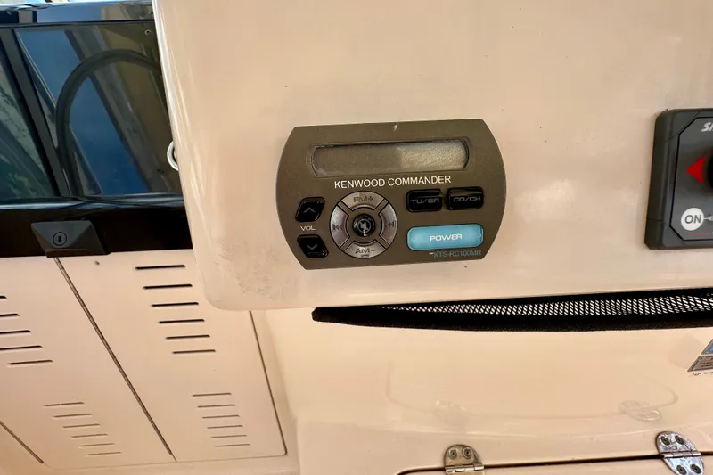 Slide: The Image of Kenwood Commander audio control panel on 2007 Grady-White Express 330 boat. - 68