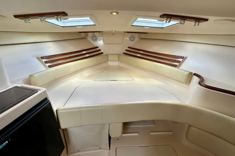 Slide: The Image of Interior cabin of 2007 Grady-White Express 330 boat, featuring seating and skylights. - 104