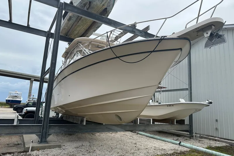 Slide: The Image of 2007 Grady-White Express 330 boat on dry dock, side view. - 7