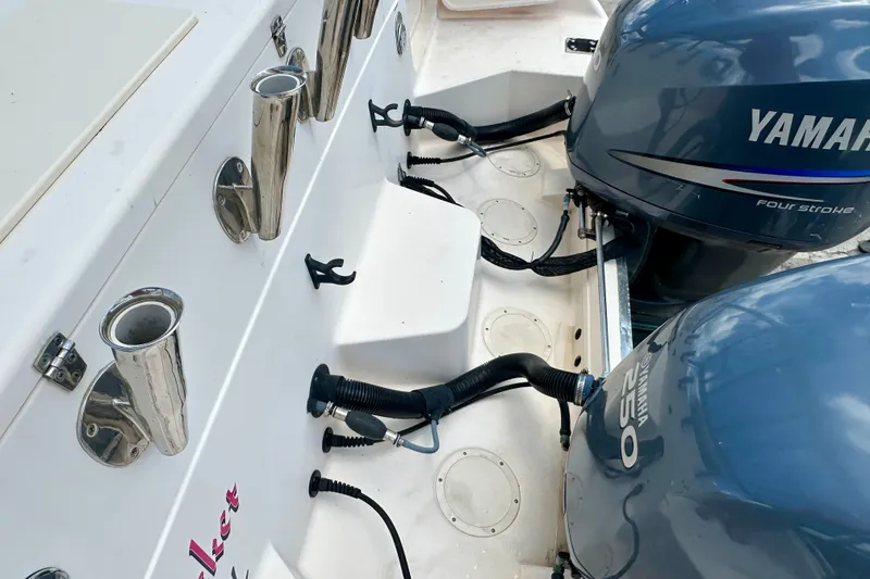 Slide: The Image of 2007 Grady-White Express 330 boat with Yamaha outboard engines and rod holders. - 26