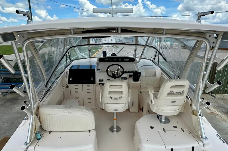 Slide: The Image of 2007 Grady-White Express 330 boat interior with helm, seating, and clear skies. - 28