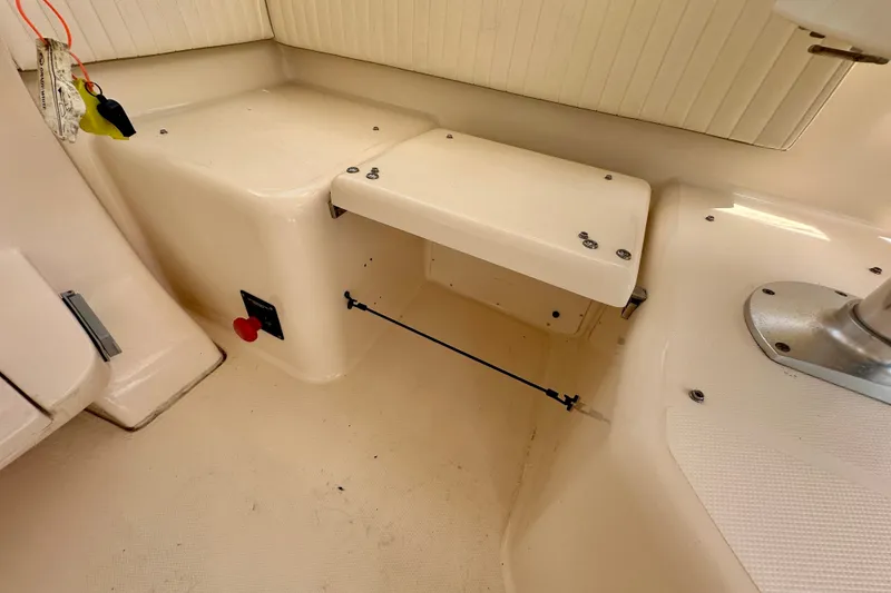 Slide: The Image of 2007 Grady-White Express 330 interior detail, showcasing seating and storage area. - 62