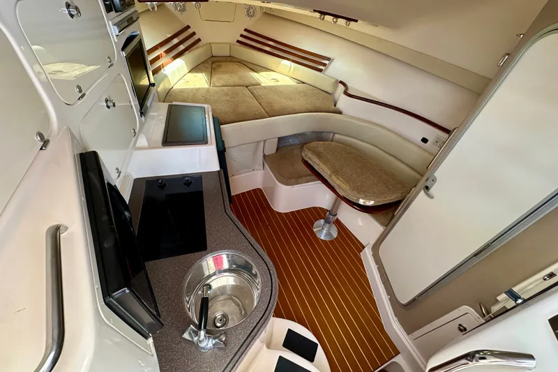 Slide: The Image of Luxurious interior of a 2007 Grady-White Express 330 boat with cozy seating and kitchenette. - 20