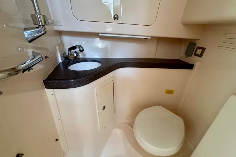 Slide: The Image of 2007 Grady-White Express 330 boat bathroom with sink and toilet. - 87