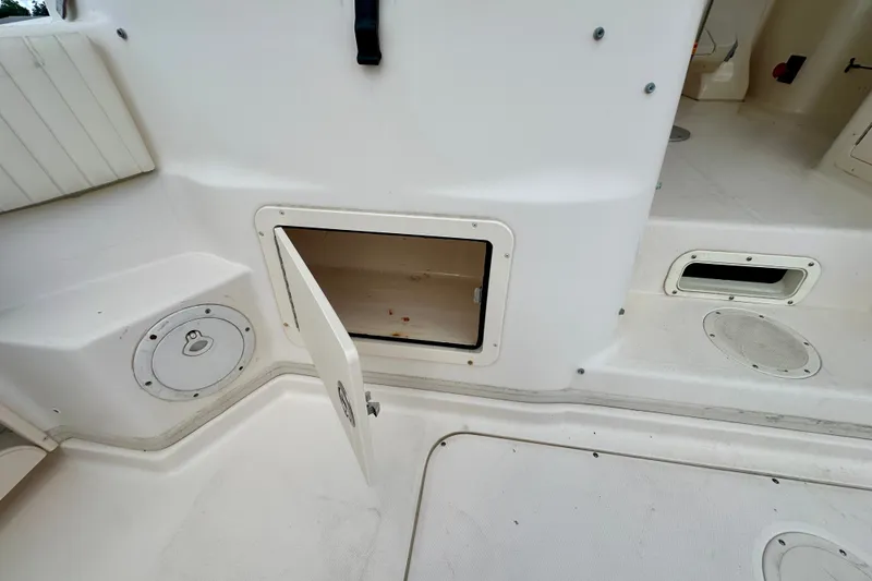 Slide: The Image of Open storage compartment on a 2007 Grady-White Express 330 boat deck. - 51