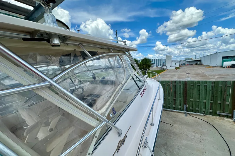Slide: The Image of 2007 Grady-White Express 330 boat docked, showcasing sleek design and clear skies. - 41
