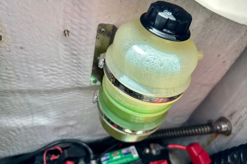 Slide: The Image of Coolant reservoir in a 2007 Grady-White Express 330 boat engine compartment. - 109
