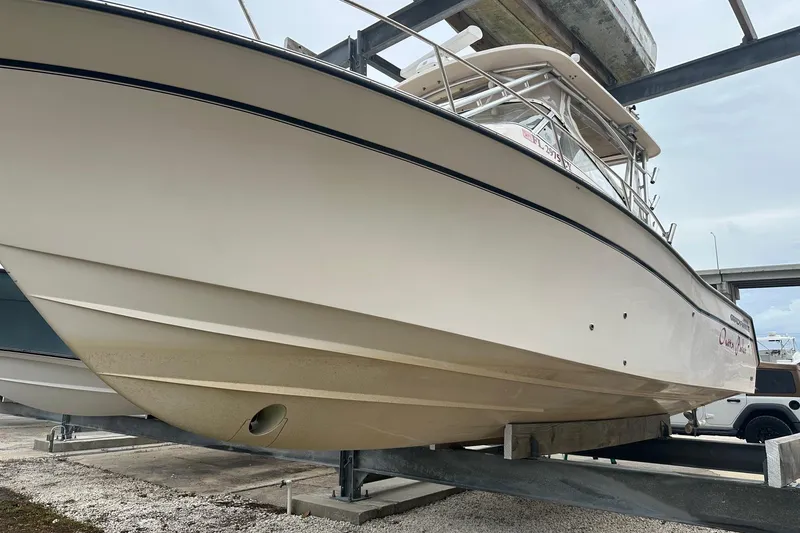 Slide: The Image of 2007 Grady-White Express 330 boat on a lift, side view. - 8