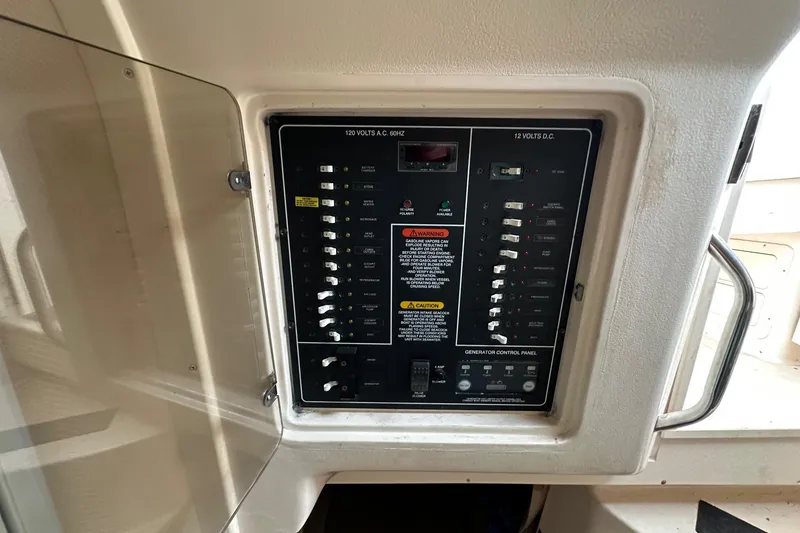 Slide: The Image of Electrical control panel on a 2007 Grady-White Express 330 boat. - 5