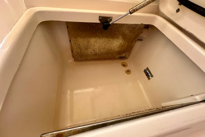 Slide: The Image of 2007 Grady-White Express 330 boat compartment interior, showing clean storage space. - 60