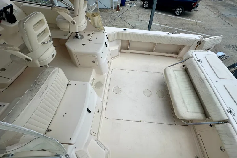 Slide: The Image of 2007 Grady-White Express 330 boat interior with white seating and spacious deck area. - 29