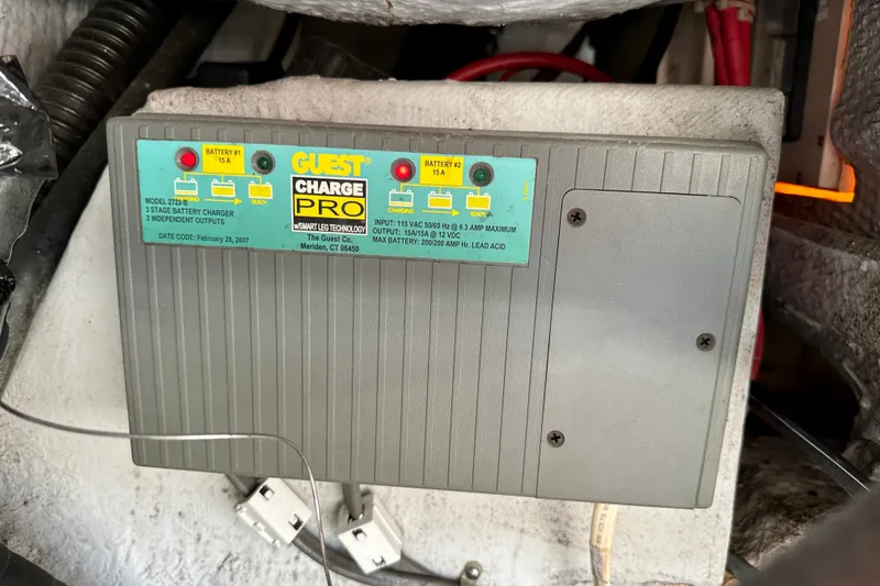 Slide: The Image of Battery charger in a 2007 Grady-White Express 330 boat engine compartment. - 115