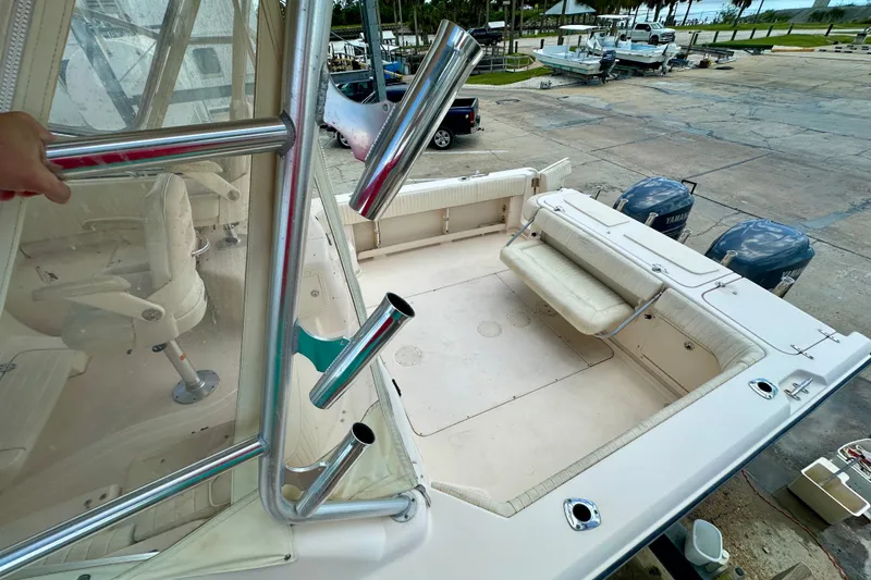 Slide: The Image of 2007 Grady-White Express 330 boat deck with seating and dual Yamaha engines. - 30