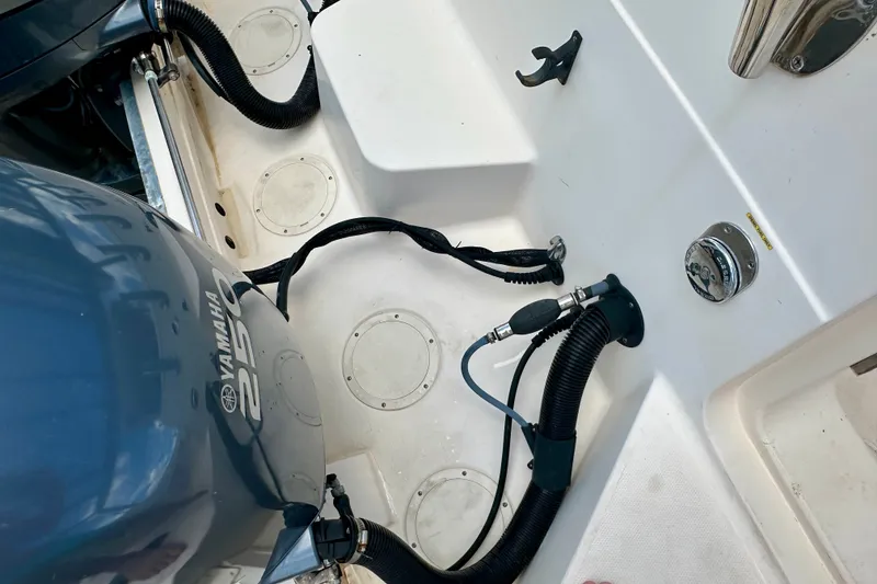 Slide: The Image of 2007 Grady-White Express 330 boat deck with Yamaha 250 engine and fuel connections. - 27