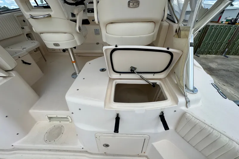 Slide: The Image of 2007 Grady-White Express 330 boat interior with open storage compartment. - 56