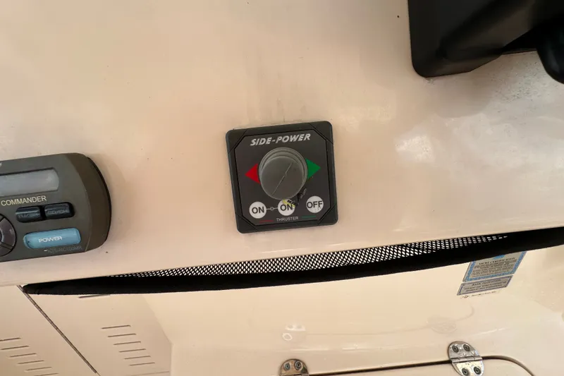 Slide: The Image of Control panel on a 2007 Grady-White Express 330 boat, featuring Side-Power thruster controls. - 69