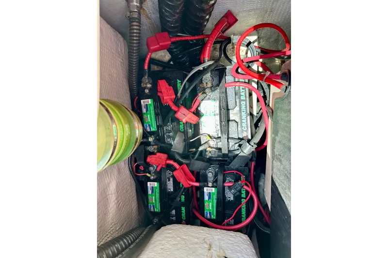 Slide: The Image of Battery compartment of a 2007 Grady-White Express 330 boat with wiring connections. - 110