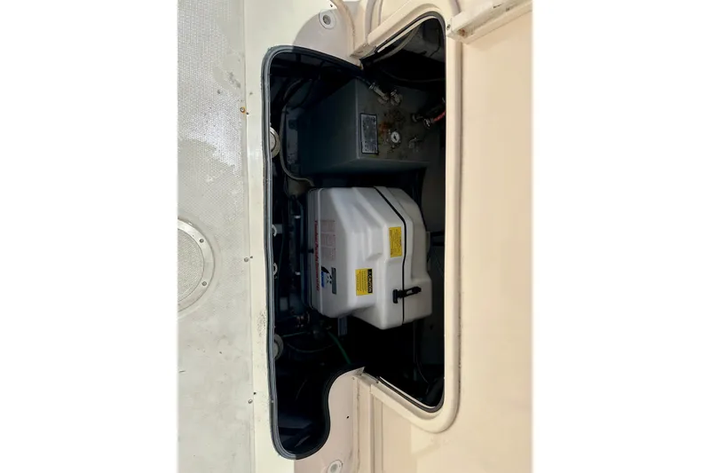 Slide: The Image of 2007 Grady-White Express 330 engine compartment with visible components and wiring. - 117