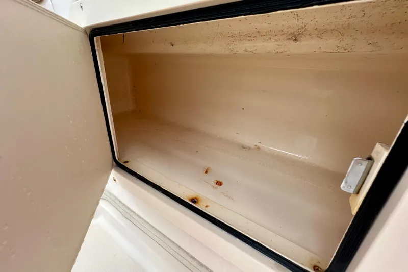 Slide: The Image of Open storage compartment on a 2007 Grady-White Express 330 boat. - 50