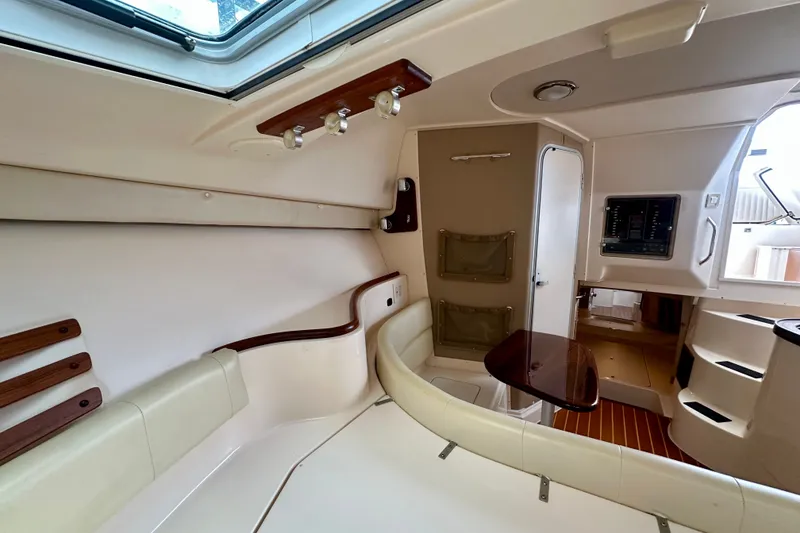 Slide: The Image of Interior of 2007 Grady-White Express 330 boat with seating and wooden accents. - 94